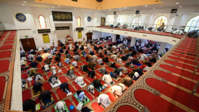 Muslims gather to perform the Eid Al-Fitr prayer, which marks the end of the holy month of Ramadan, at Bradford Central Mosque in Bradford, northern England on May 13, 2021.
