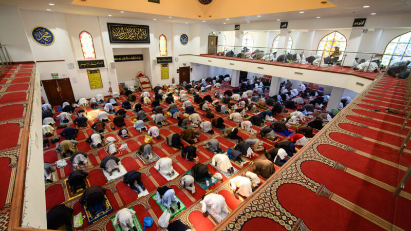 Muslims gather to perform the Eid Al-Fitr prayer, which marks the end of the holy month of Ramadan, at Bradford Central Mosque in Bradford, northern England on May 13, 2021.