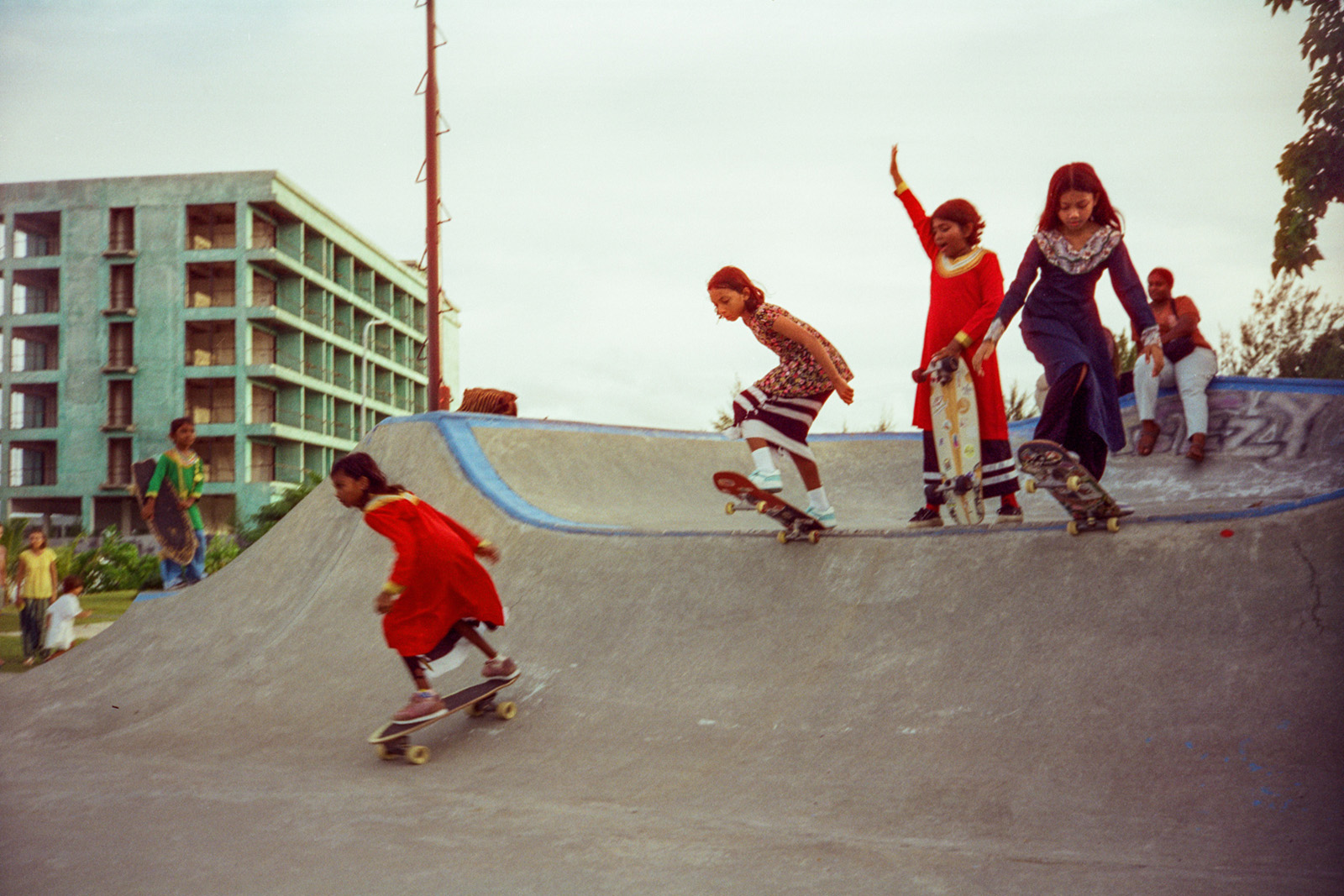 Photographs of women and girls skateboarding, taken in the Maldives over six weeks of summer 2024 by Sophia Nasif.