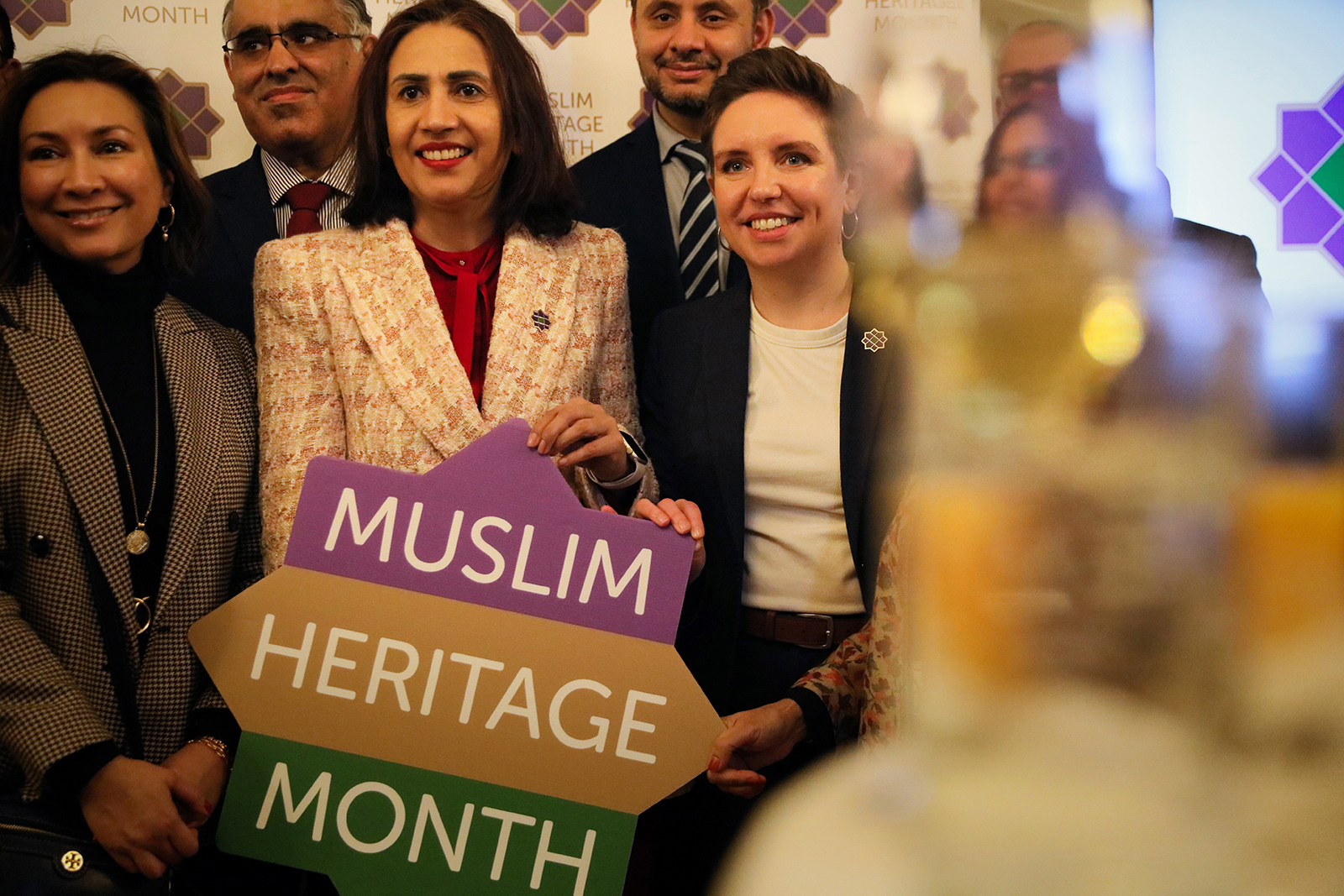 Baroness Shaista Gohir (left) and Green party co-leader Carla Denyer pose for a group photo during the launch of Muslim Heritage Month at the House of Lords on March 11, 2025 in London, England. 