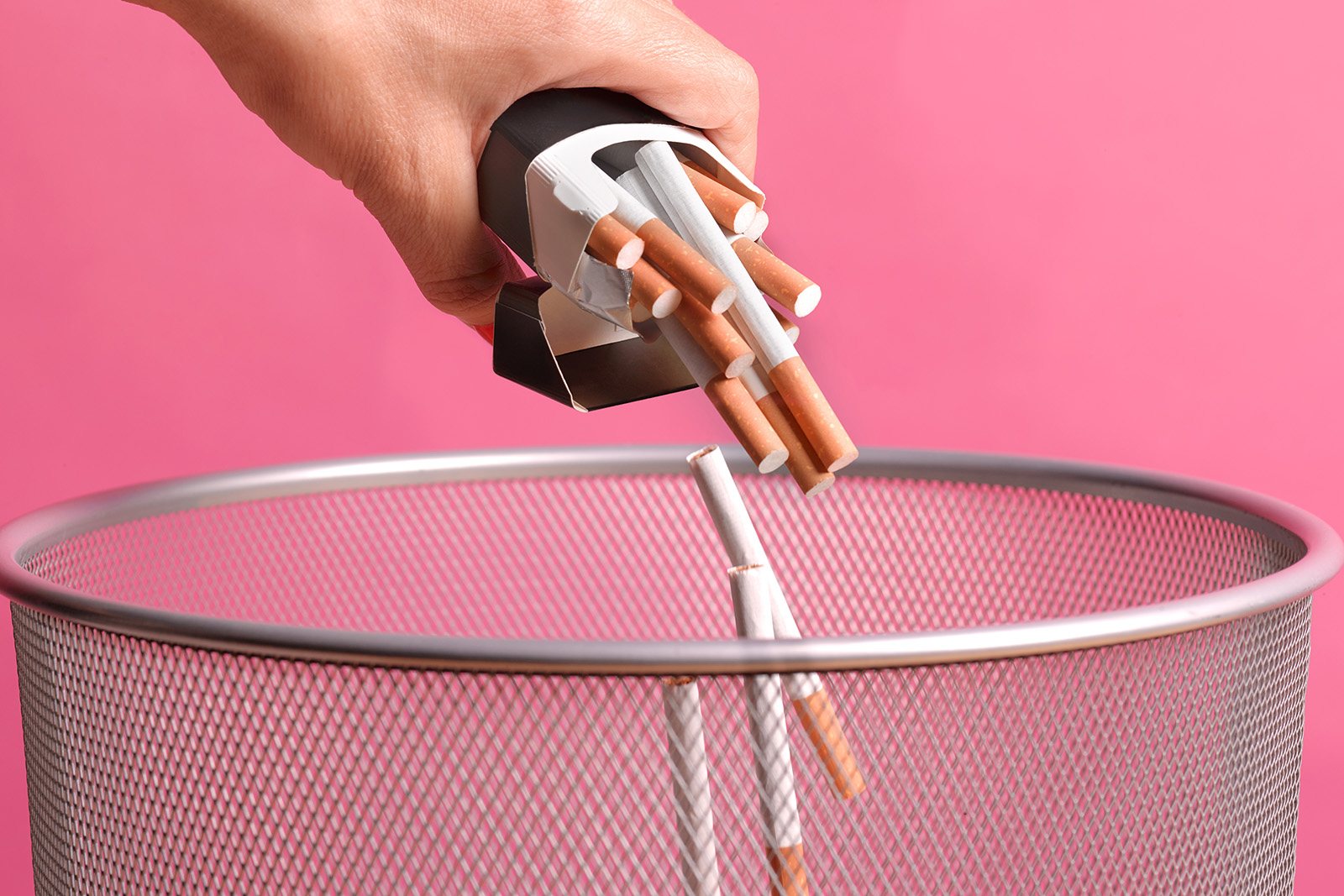 cigarettes being tipped into a bin