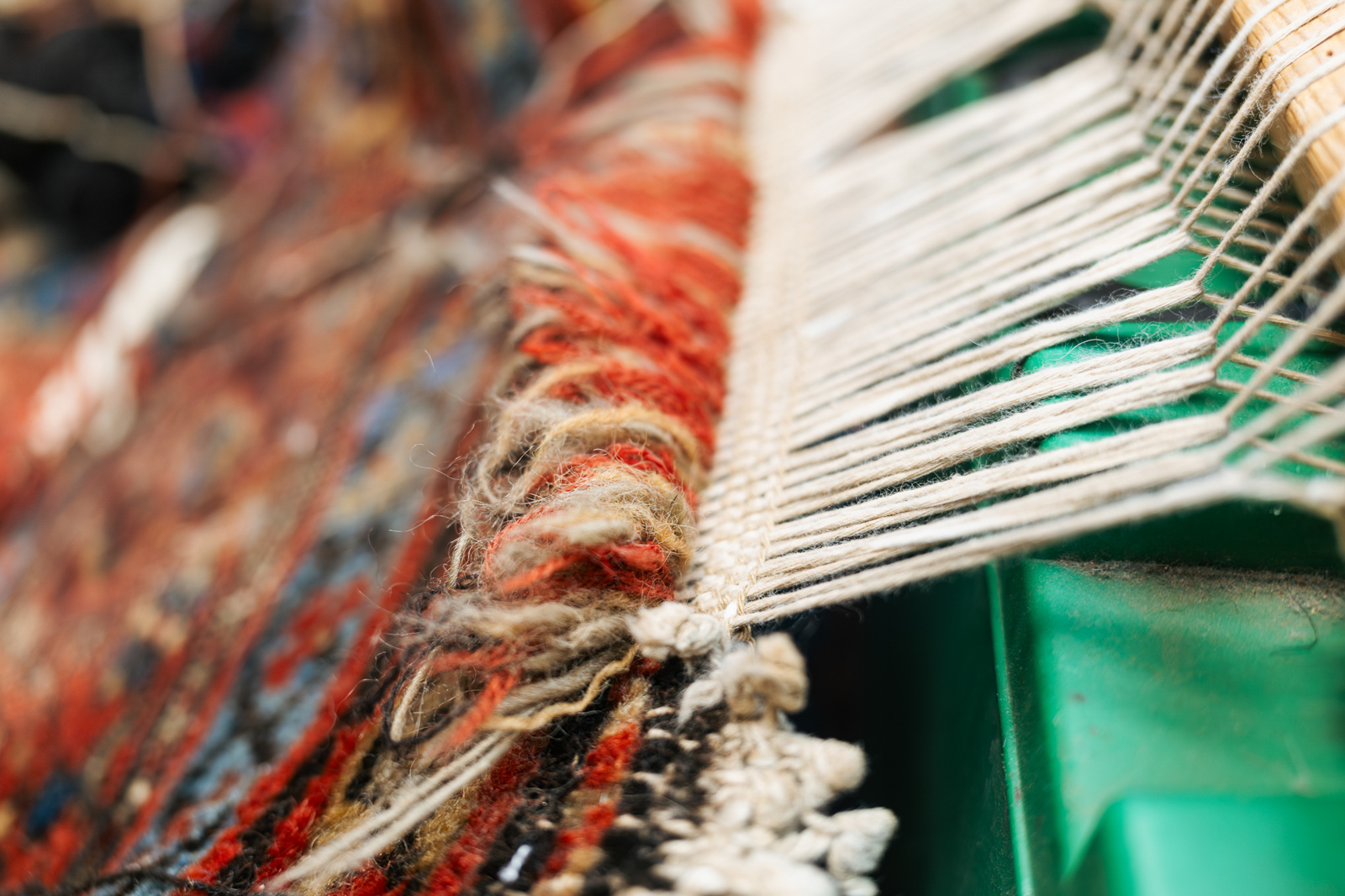 Tassels on a handwoven rug at Thames Carpets