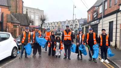 Members of Sparkhill Litter Busters, a community group formed in 2021 to clean up the streets of their Birmingham neighbourhood.