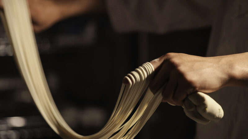 A chef making hand-pulled Lanzhou noodles