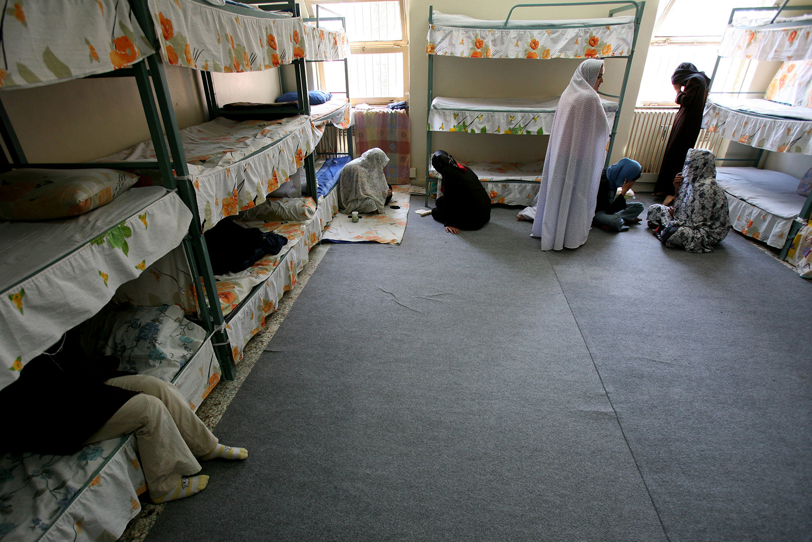 Iranian women prisoners sit inside their cell in Tehran's Evin prison, 13 June 2006.