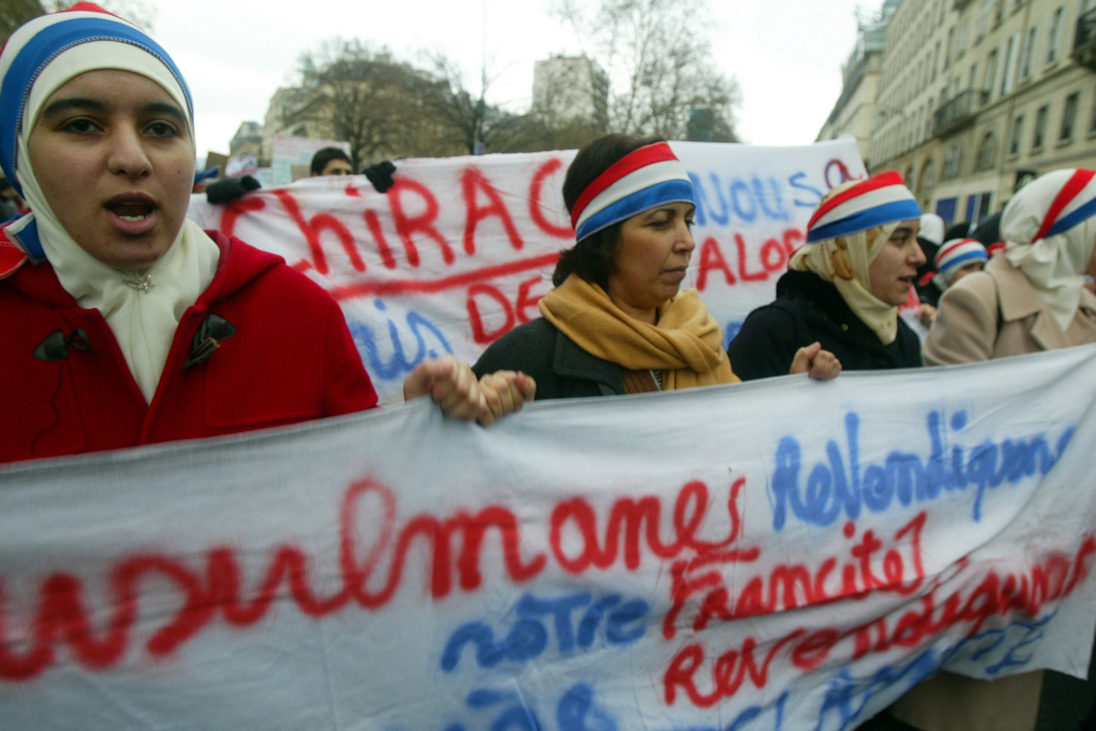 Muslim women demonstrate against the French proposal to bar Muslim women from wearing headscarves in state schools on January 17, 2004 in Paris, France.