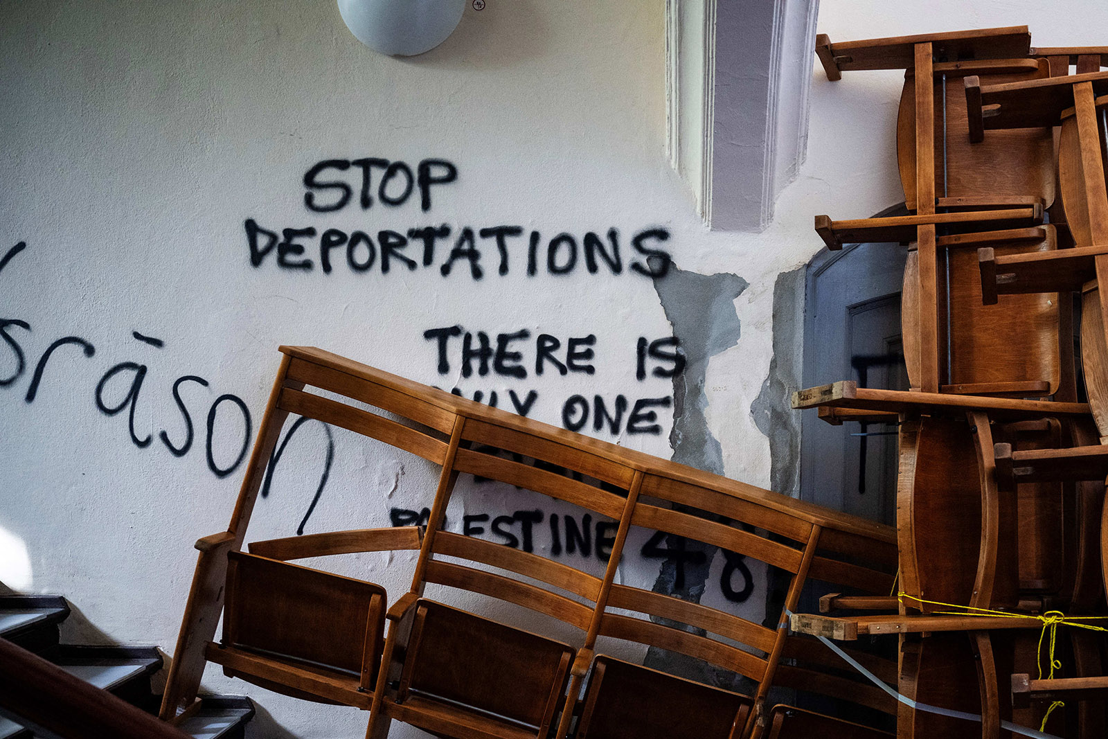 Rows of auditorium benches are propped up against the main entrance to a Humboldt University (HU) auditorium in Berlin on April 22, 2025, after the building was stormed and briefly occupied by pro-Palestinian protesters on April 16, 2025. The demonstrators were protesting against the planned deportation of four foreign students who had taken part in a similar pro-Palestinian protest in autumn 2024.