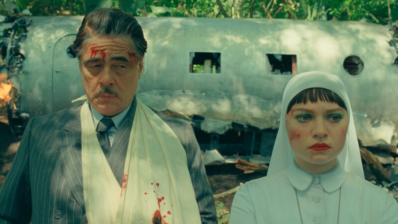 Benicio Del Toro as Zsa-Zsa Korda and Mia Threapleton as Liesl in Wes Anderson's The Phoenician Scheme.