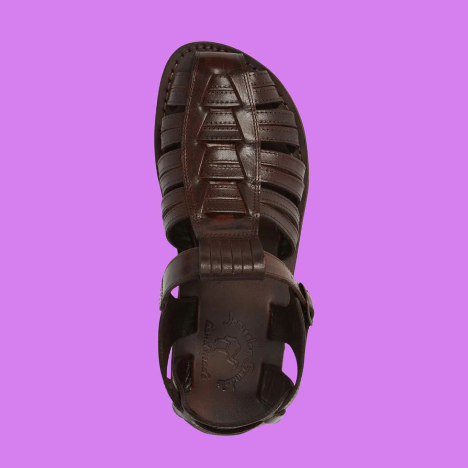Brown leather sandal on purple background