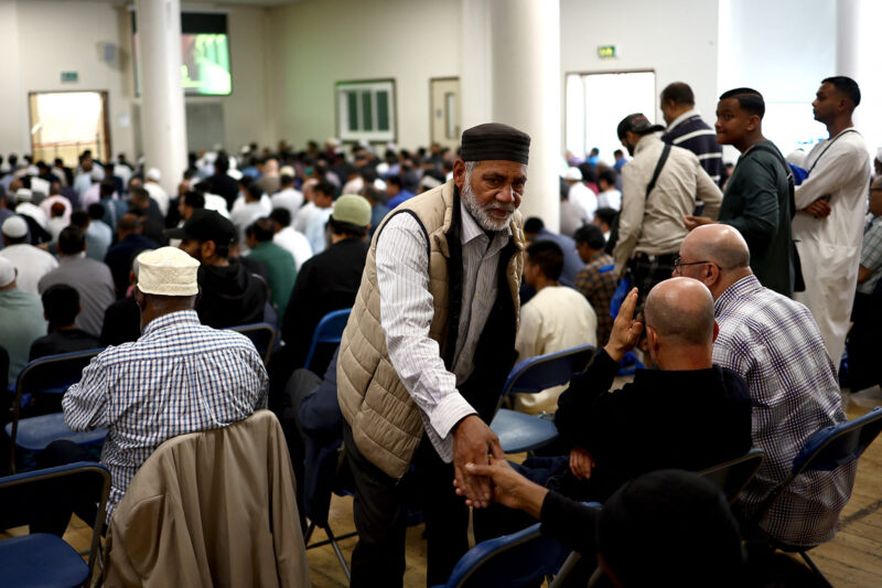 Worshippers arrive to attend Friday prayers at the East London Mosque in Tower Hamlets, London on August 9, 2024. Disturbances first sparked by a July 29 knife attack that killed three children, have seen mosques and migrant-related facilities attacked alongside police and other targets.