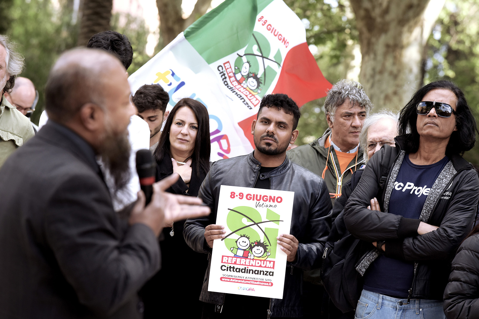 ROME, ITALY - APRIL 17: People participate in the launch for the yes to the Referendum on citizenship for citizens of foreign origin, with flags and posters with the symbol, at Piazza Vittorio, on April 17, 2025 in Rome, Italy. On June 8 and 9, Italy will vote for five abrogative referenda, four on the issue of work and one on citizenship for foreigners. The proposal aims to repeal the current requirement of ten years of legal residence in Italy to obtain citizenship, reducing it to five. 