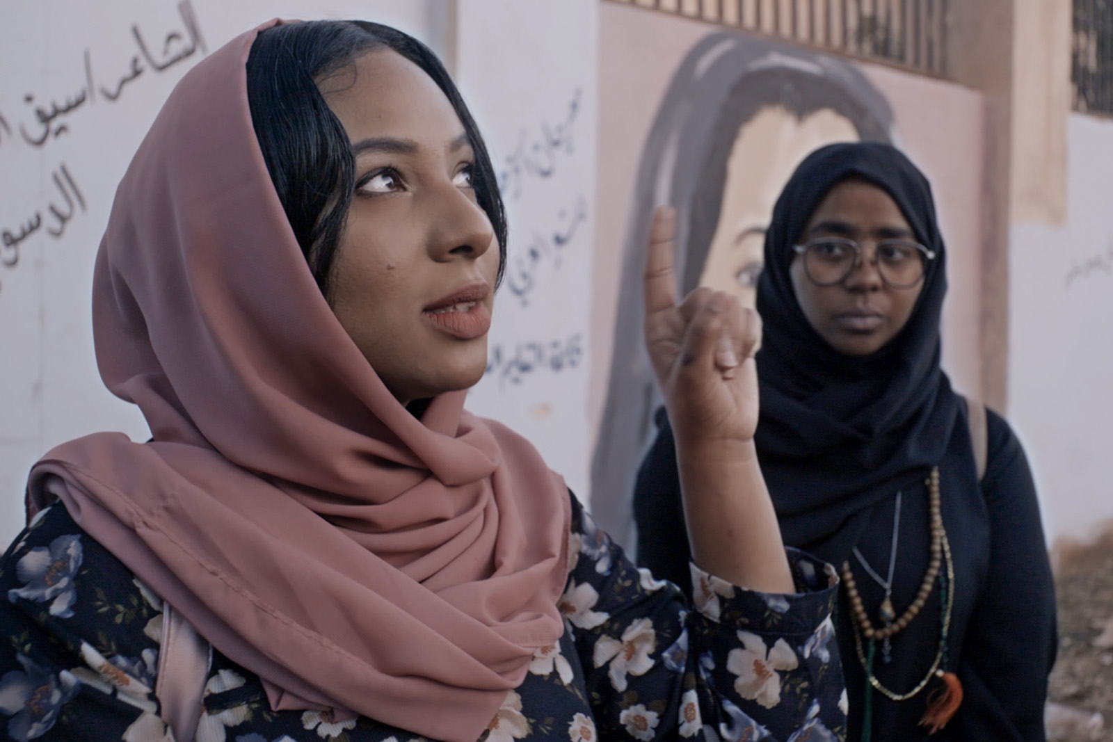 Two Muslim Women in a scene from Sudan, Remember Us