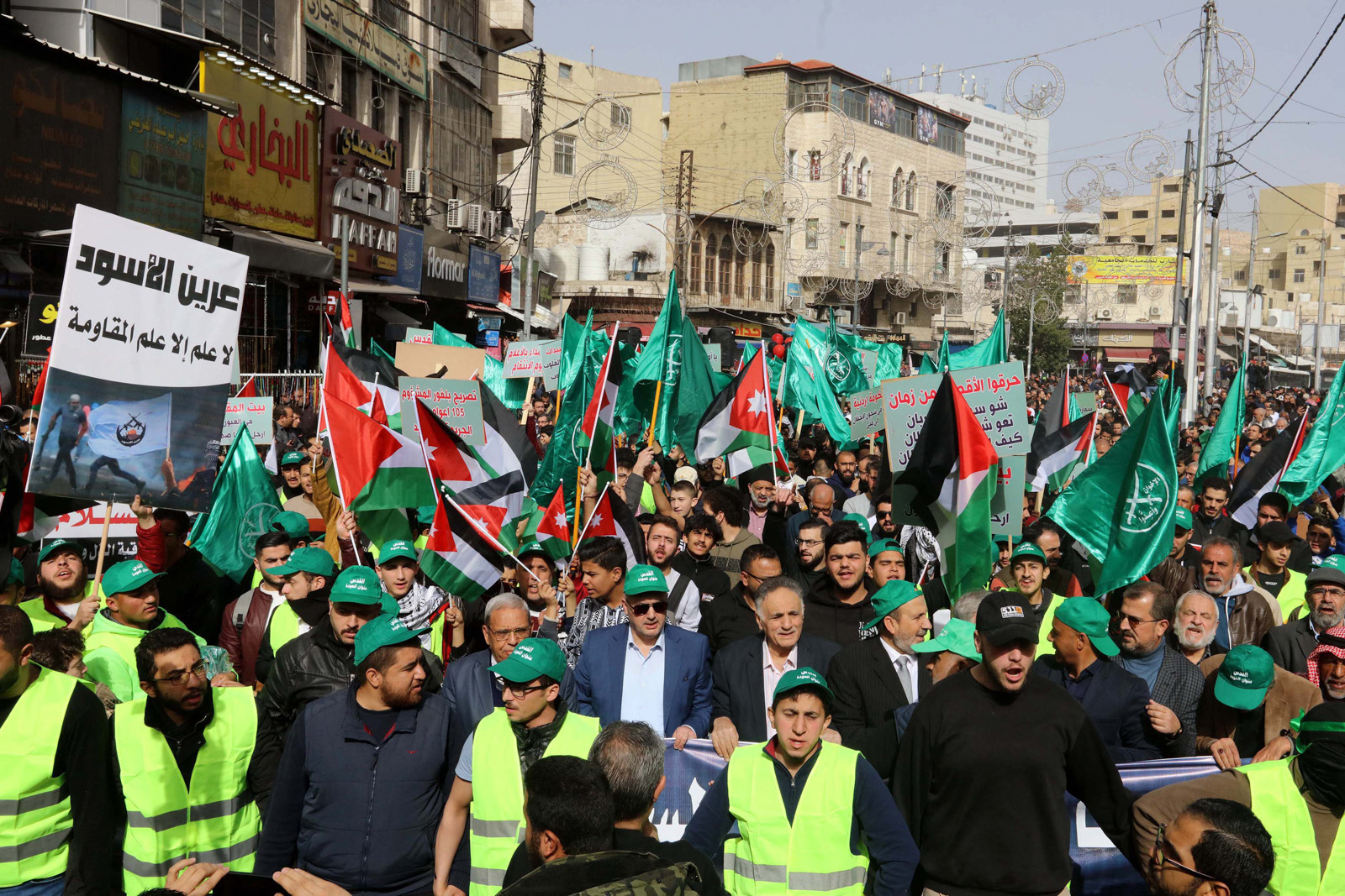 Protesters in the Jordanian capital Amman with national, Palestinian and Muslim Brotherhood flags in January 2023.