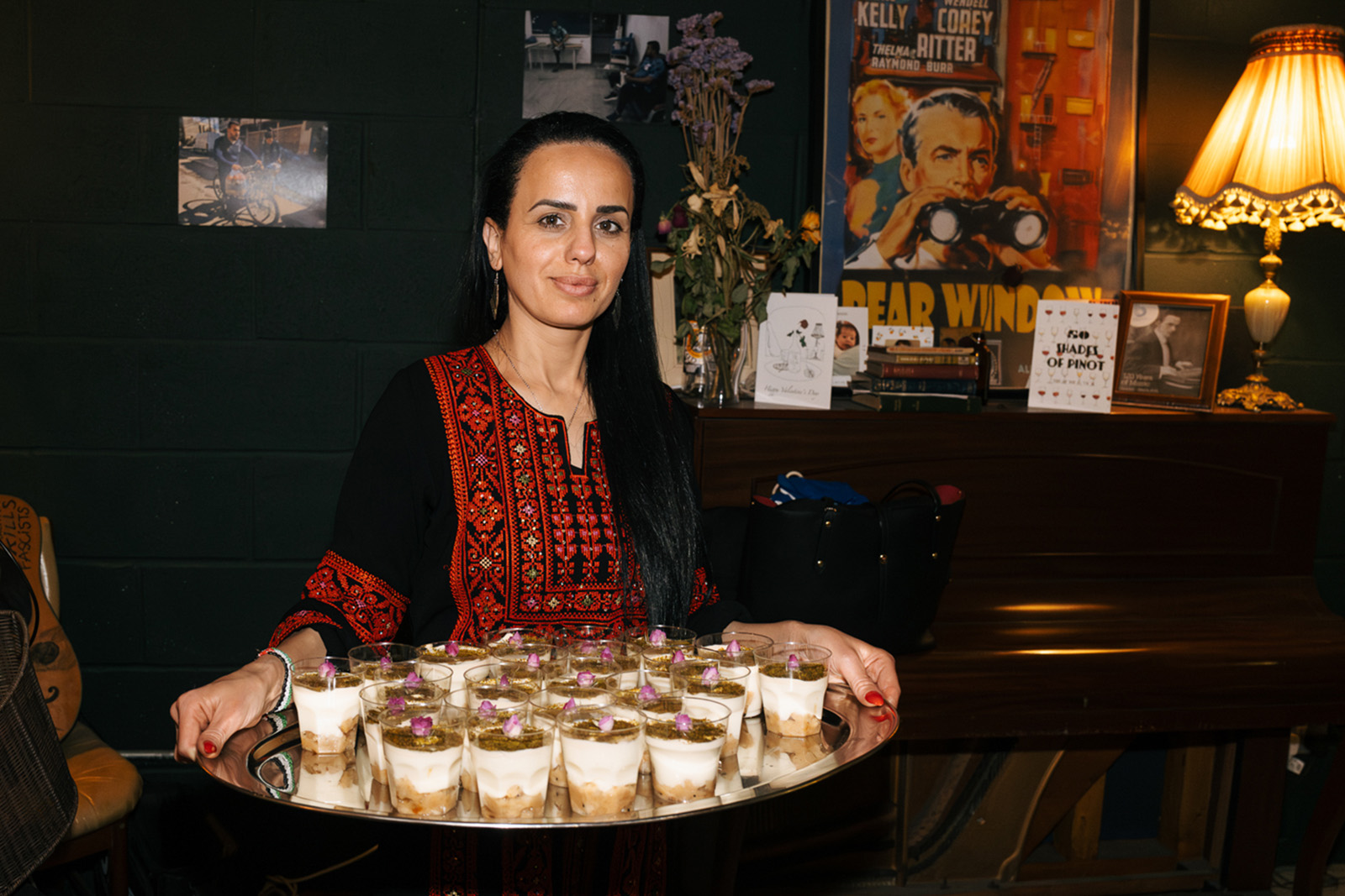 Chef Nour Elnono with a tray of desserts.
