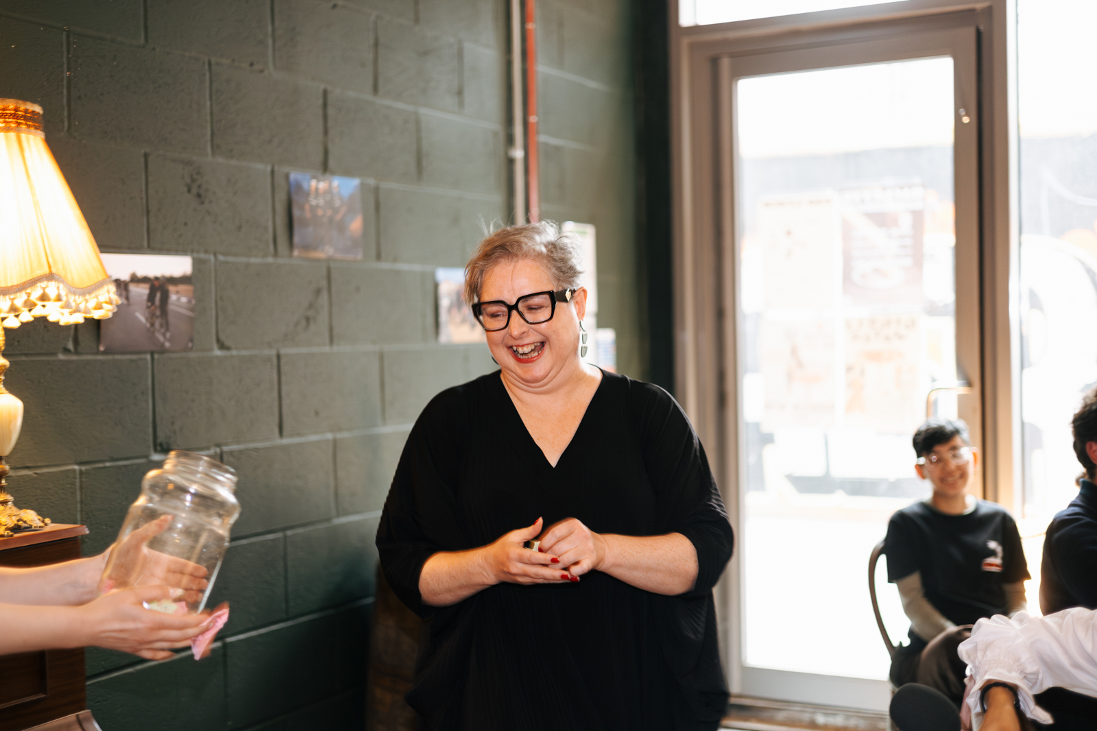 Actor Siobhán McSweeney, a supper club guest, selecting raffle tickets. 
