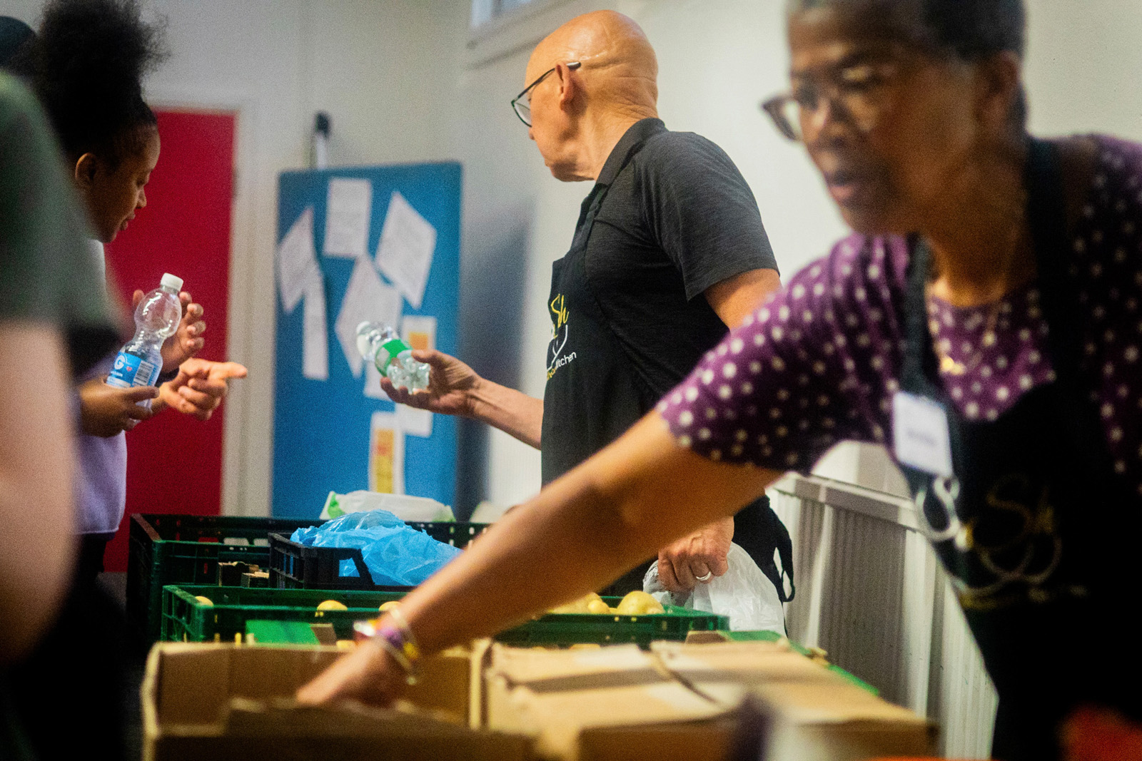 Salaam Shalom volunteers giving out groceries.