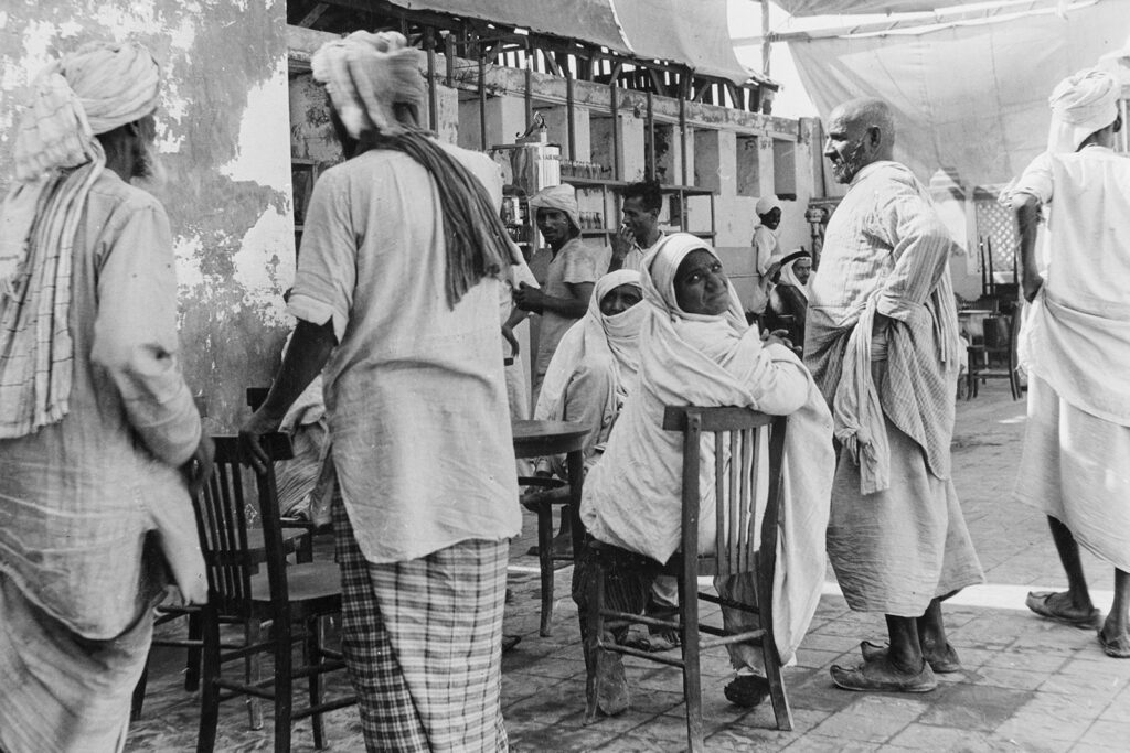 Pilgrims during the Hajj, an annual Islamic pilgrimage to Mecca, in Jeddah, Mecca Province, Saudi Arabia, circa 1955. Variously known as Jedda, Jiddah or Jidda, and located in the Hejaz region, on the Red Sea coast, Jeddah is Saudi Arabia's second largest city.