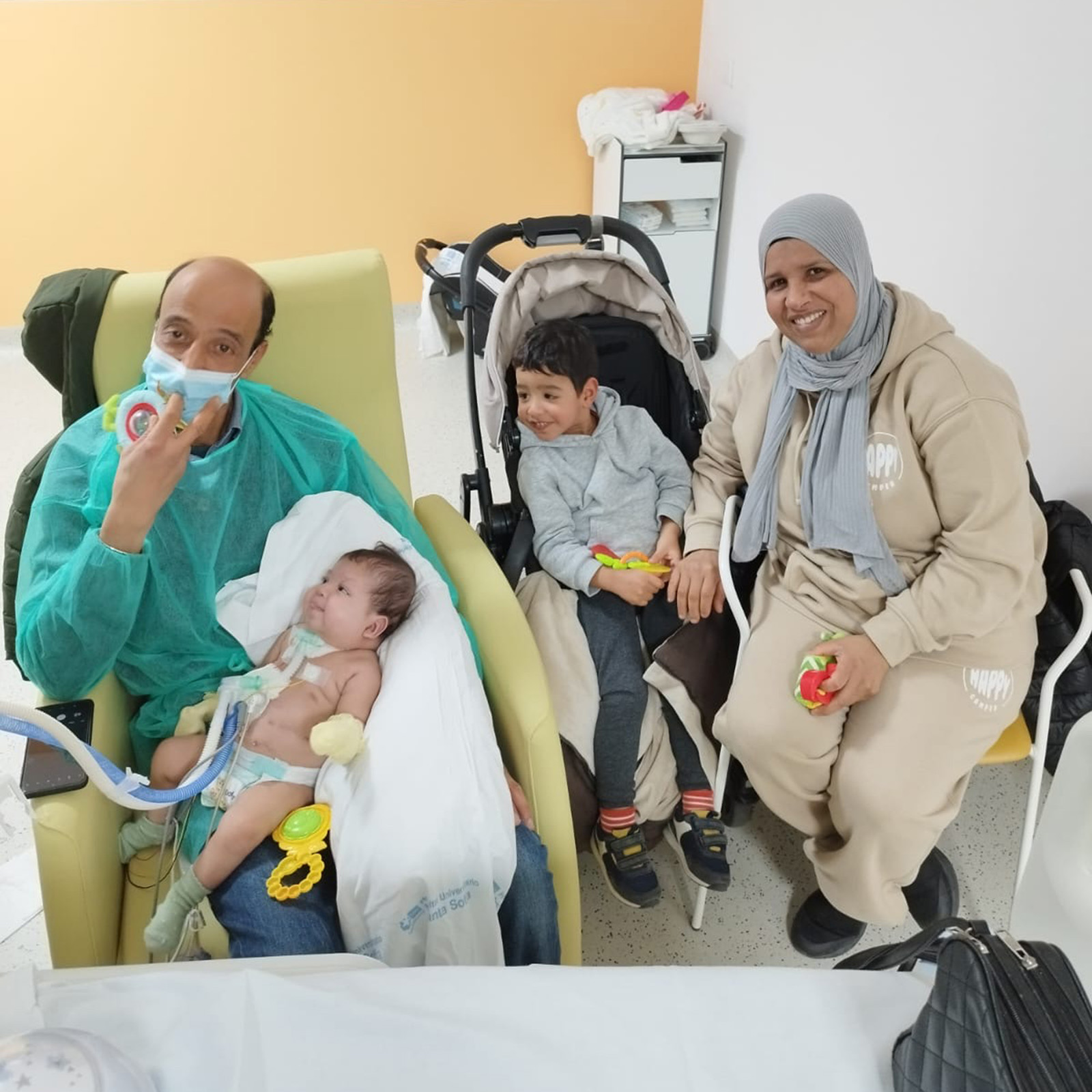 Lahcen Fal with his baby daughter and family.