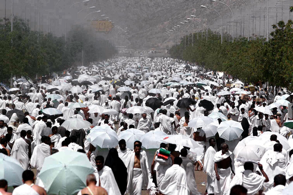 Thousands of Moslem pilgrims march towards Arafat mountain in western Saudi Arabia 26 March 1999, during the climax event of the annual pilgrimage, or hajj, to the holy cities of Mecca and Medina. Some two million Moslems are taking part in the five-day hajj.