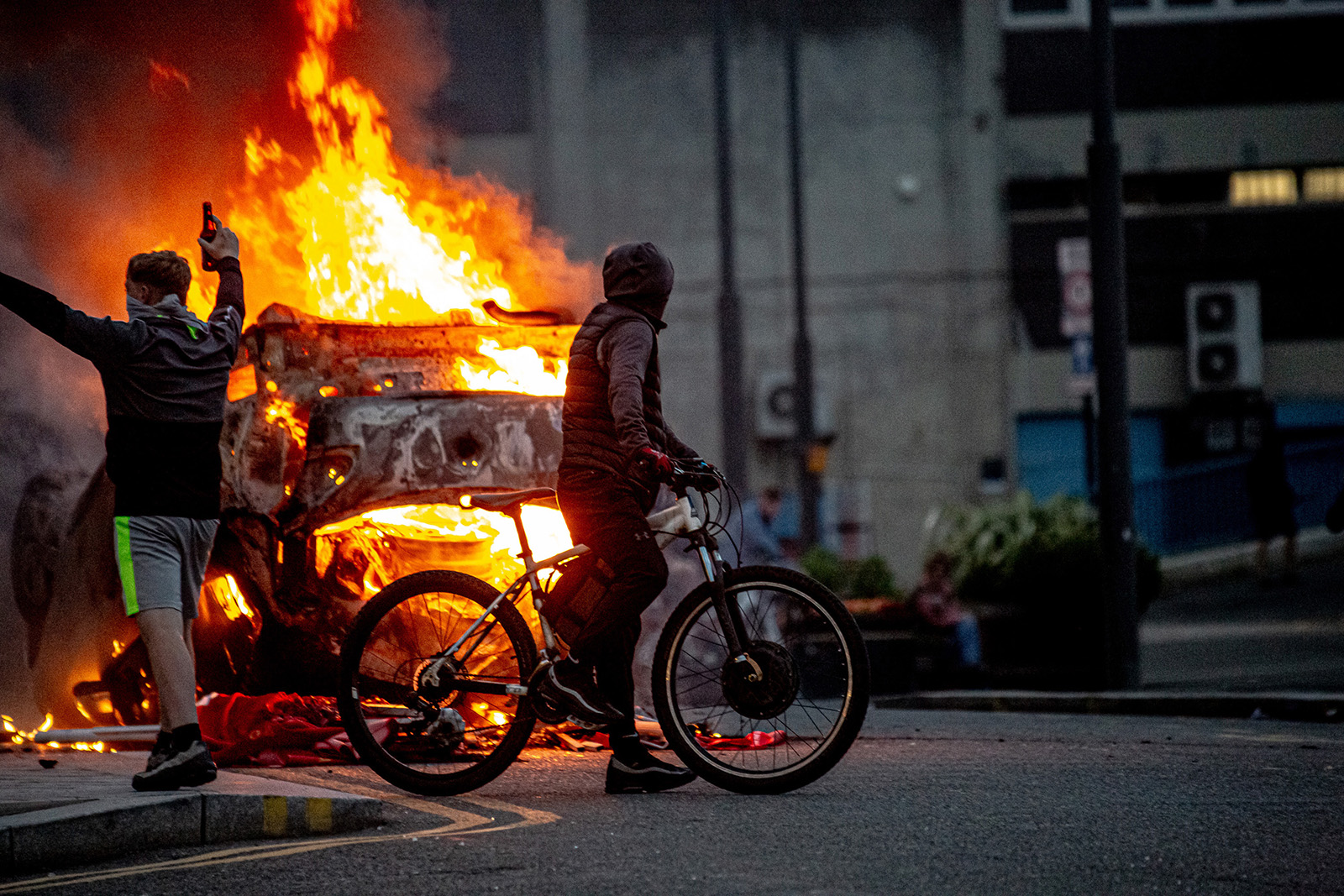 A police car on fire after a far-right protest resulted in violence and rioting in Sunderland on 2 August 2024. 