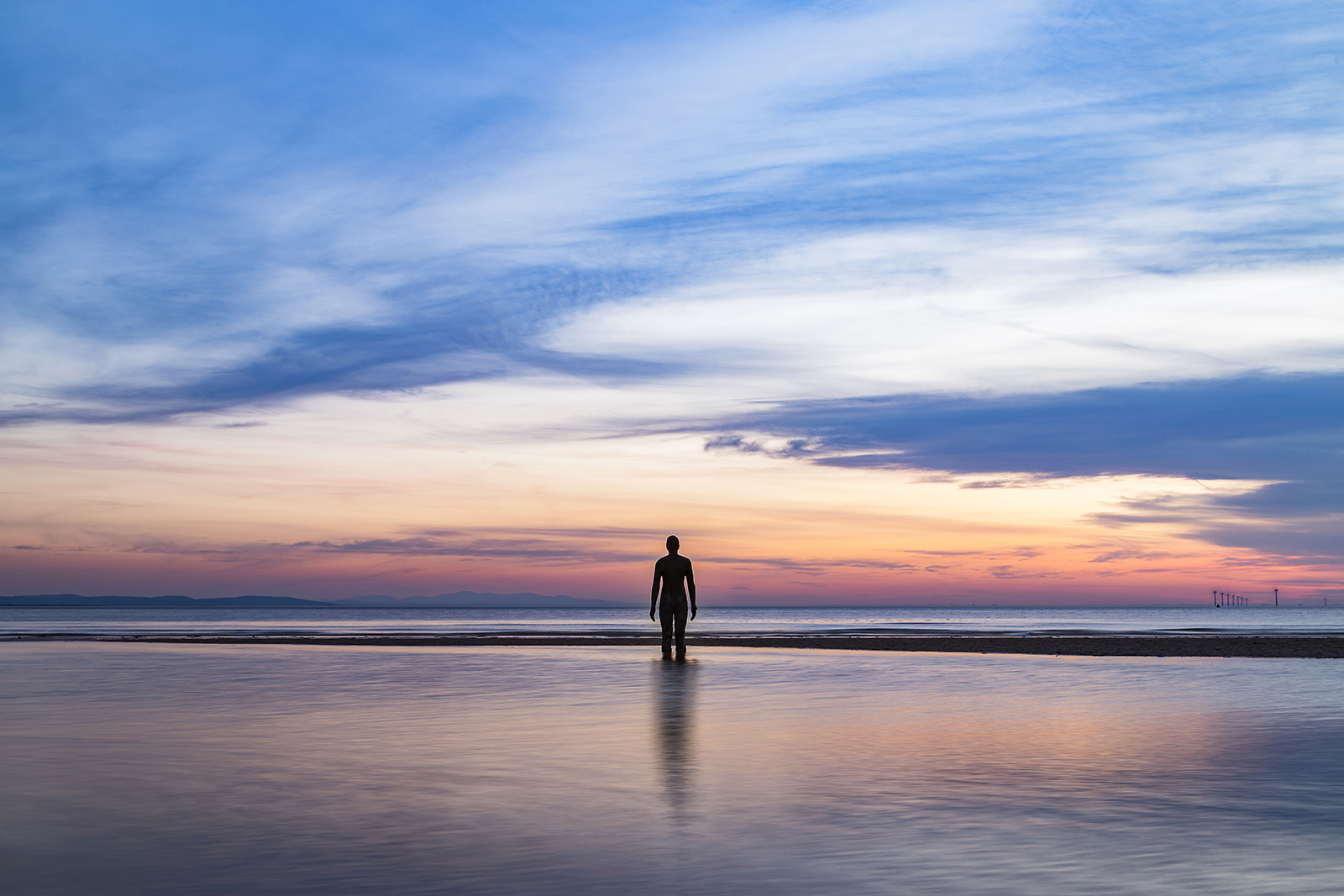 An Iron Man captured at sunset as the tide comes in.