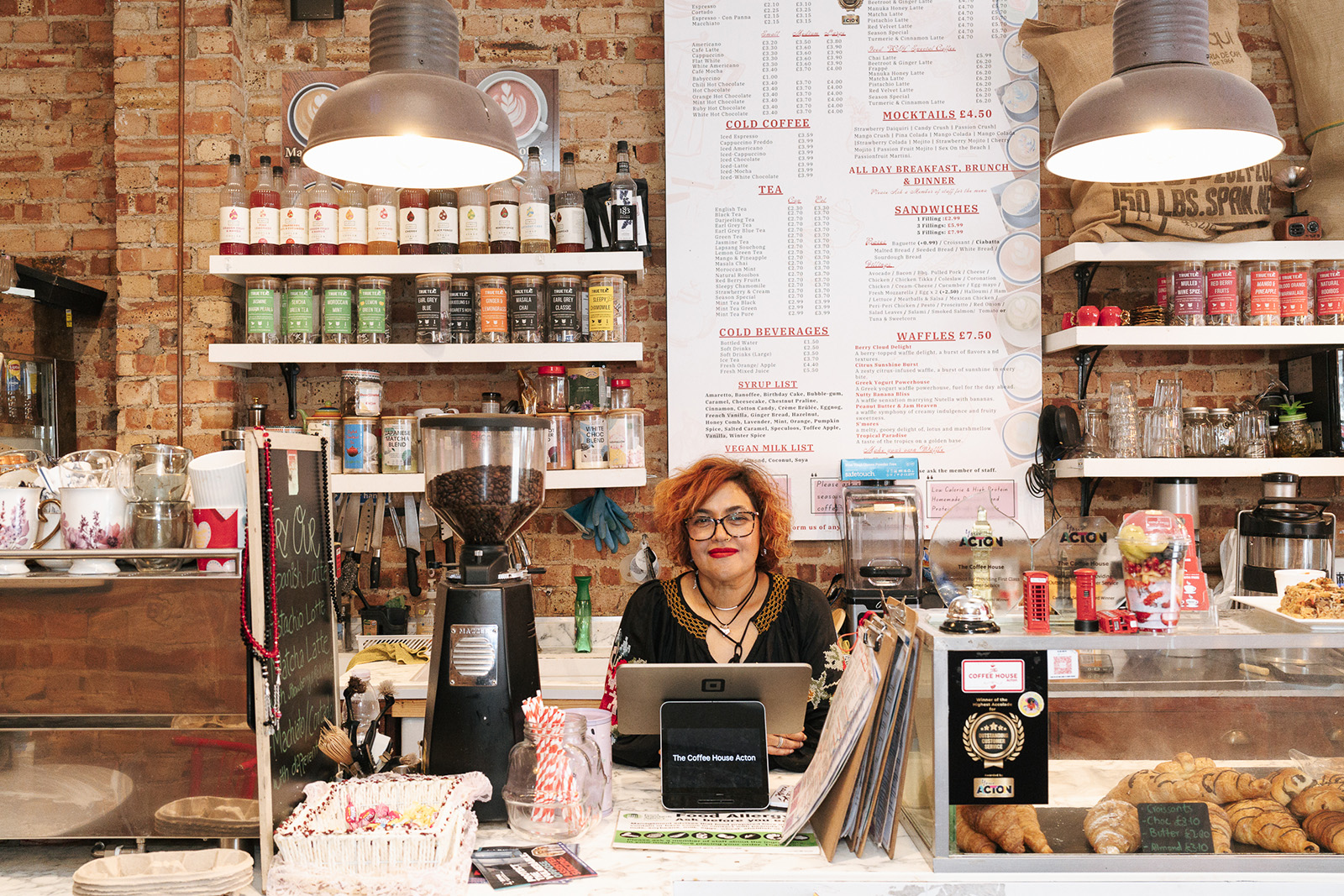 Rifat Awan, The Coffee House owner, behind the counter at her cafe in Acton, west London.