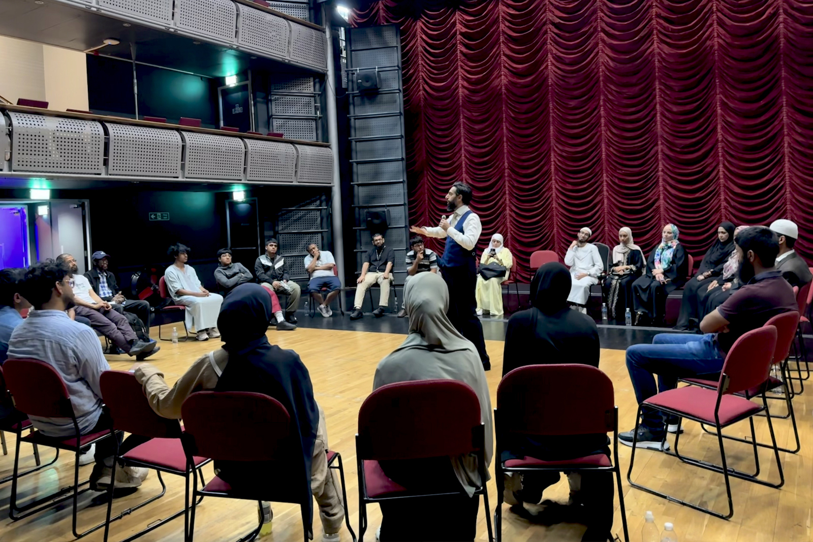 Muslim Council of Britain secretary general Dr Wajid Akhter speaks at a town hall event with young people in Stratford, east London.