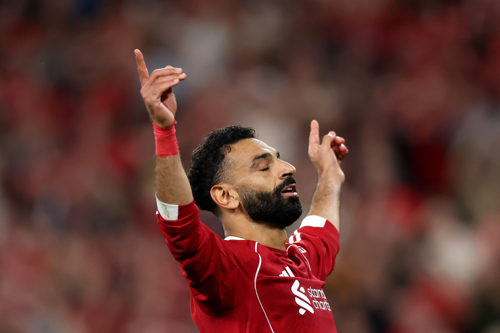 Mohamed Salah celebrates a goal during Liverpool's opening match of the 2025-26 Premier League season.