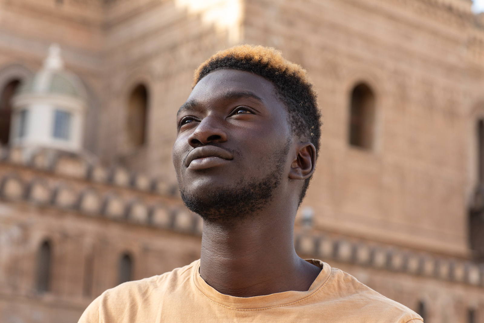 Actor Lamin Drammeh outside Palermo cathedral, Sicily.