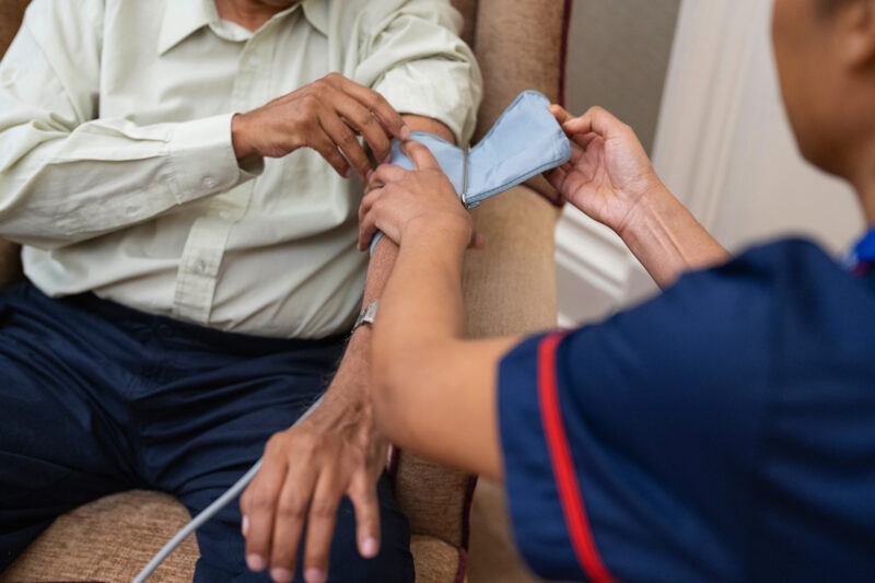 Stock image of a man having his blood pressure checked