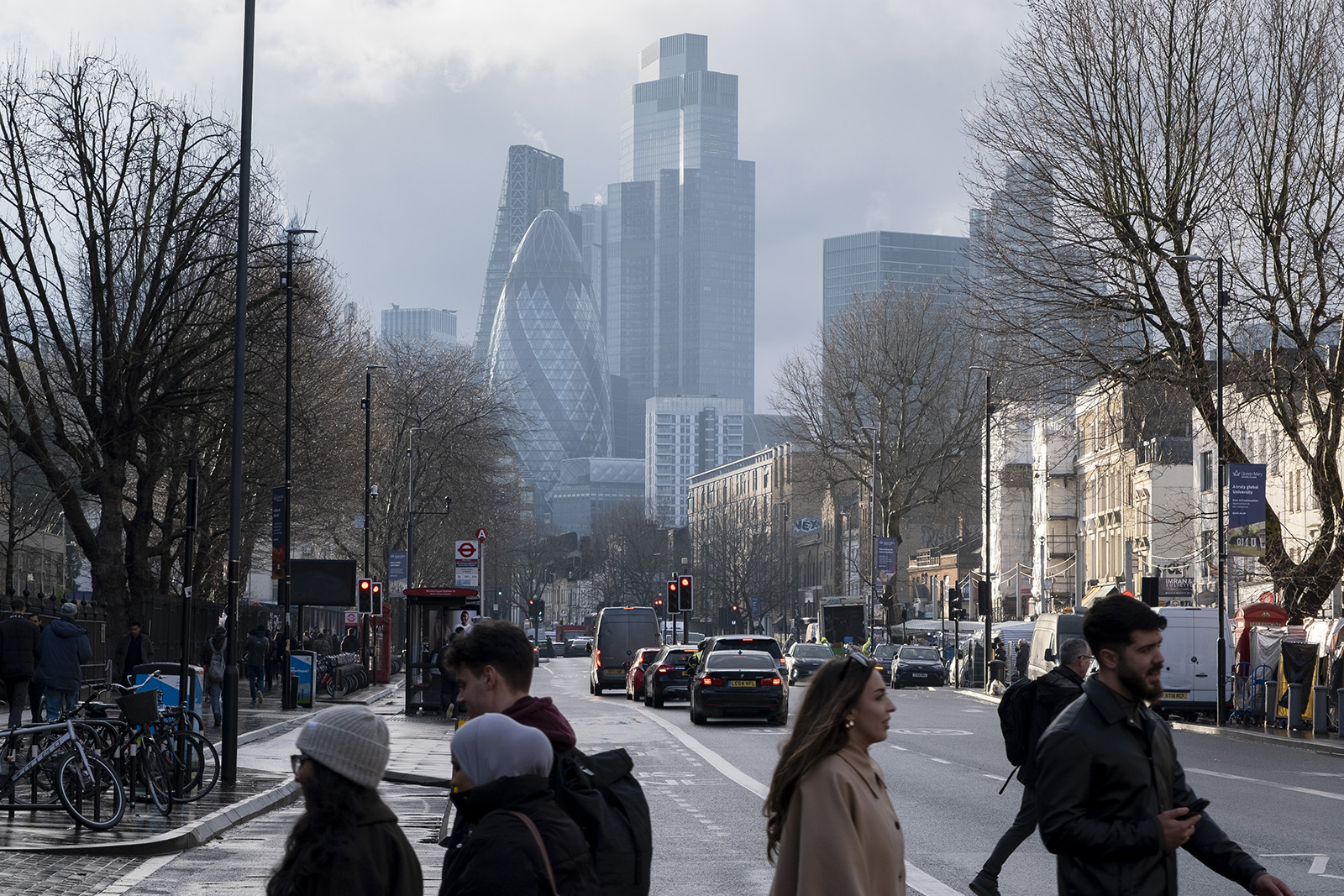 Stock image of street scene on Whitechapel High Street looking towards skyscrapers in the City of London financial district on 31 January 2025.
