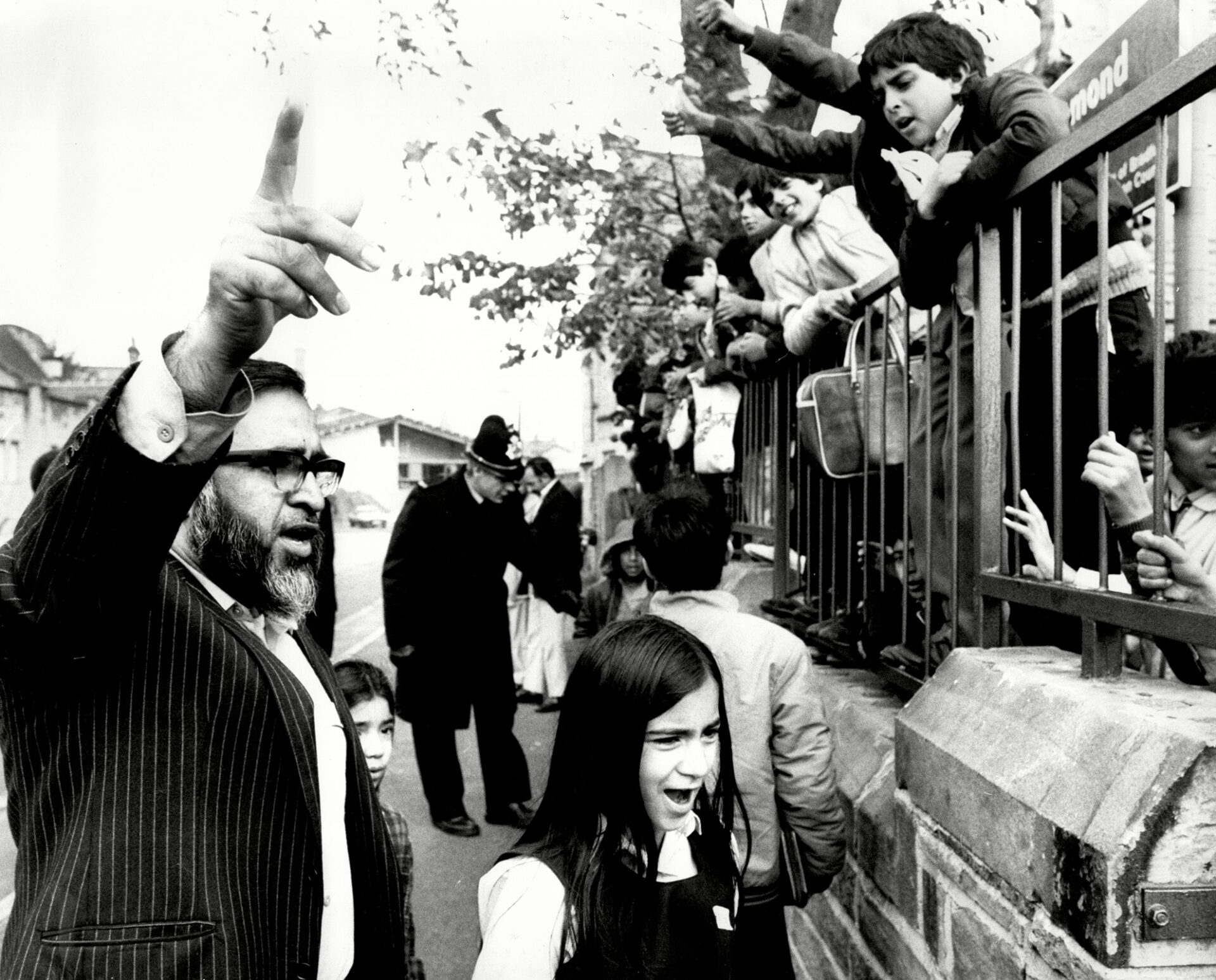 A member of the Parents Action Committee and Drummond pupils protesting against Honeyford outside the school.