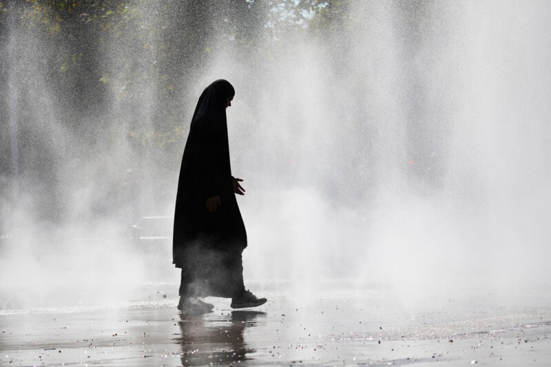 A woman wearing a hijab near Vienna's Praterstern train station