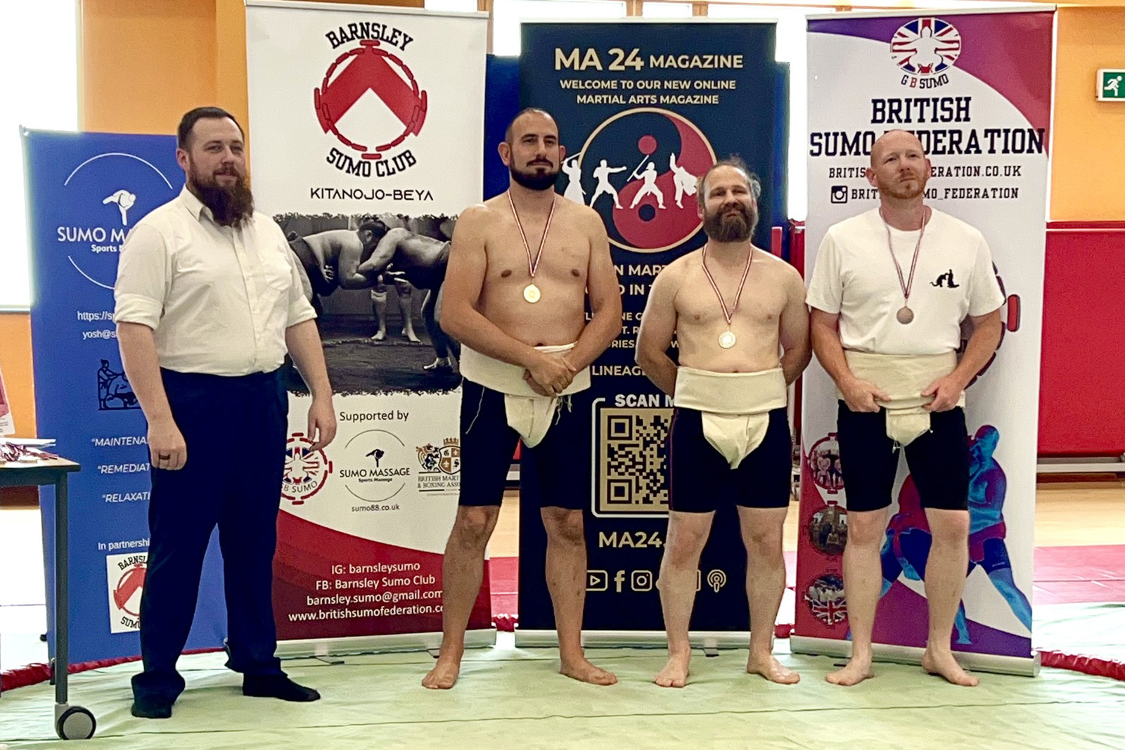 Alex Gent (second from left) with his gold medal at the British Sumo Federation Championships 2025.
