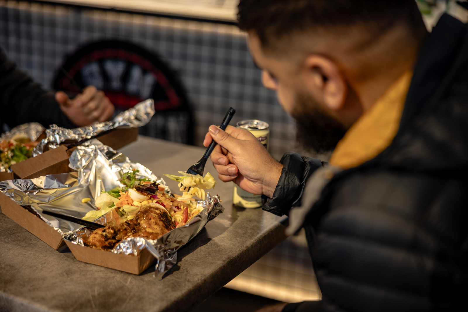 A customer enjoying one of the healthy meal options at Gym Kitchen, Bradford