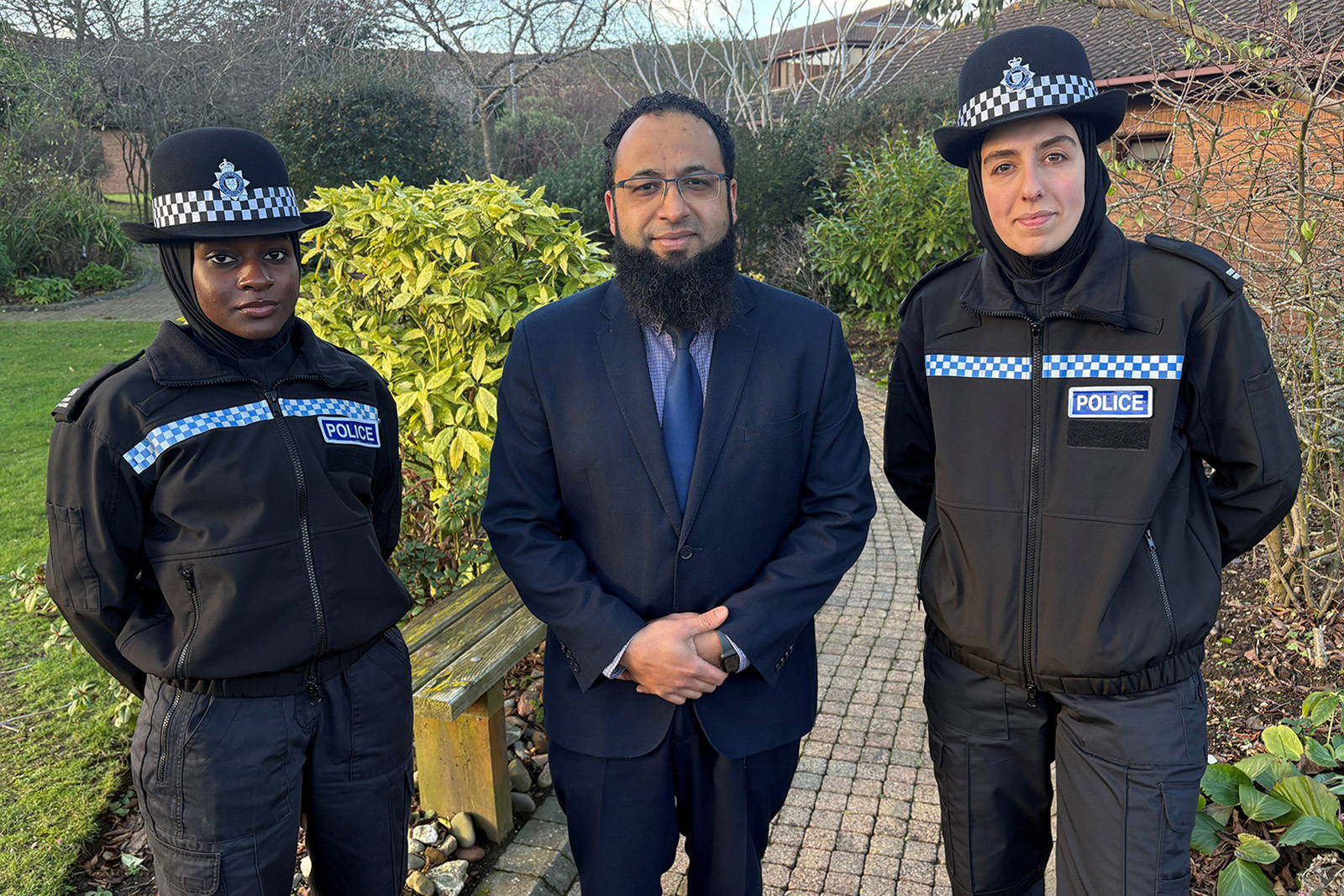 Leicestershire Police detective sergeant Yassin Desai (centre) with student officers Hafsah Abba-Gana (left) and Seher Nas wearing the 'blue light hijab'