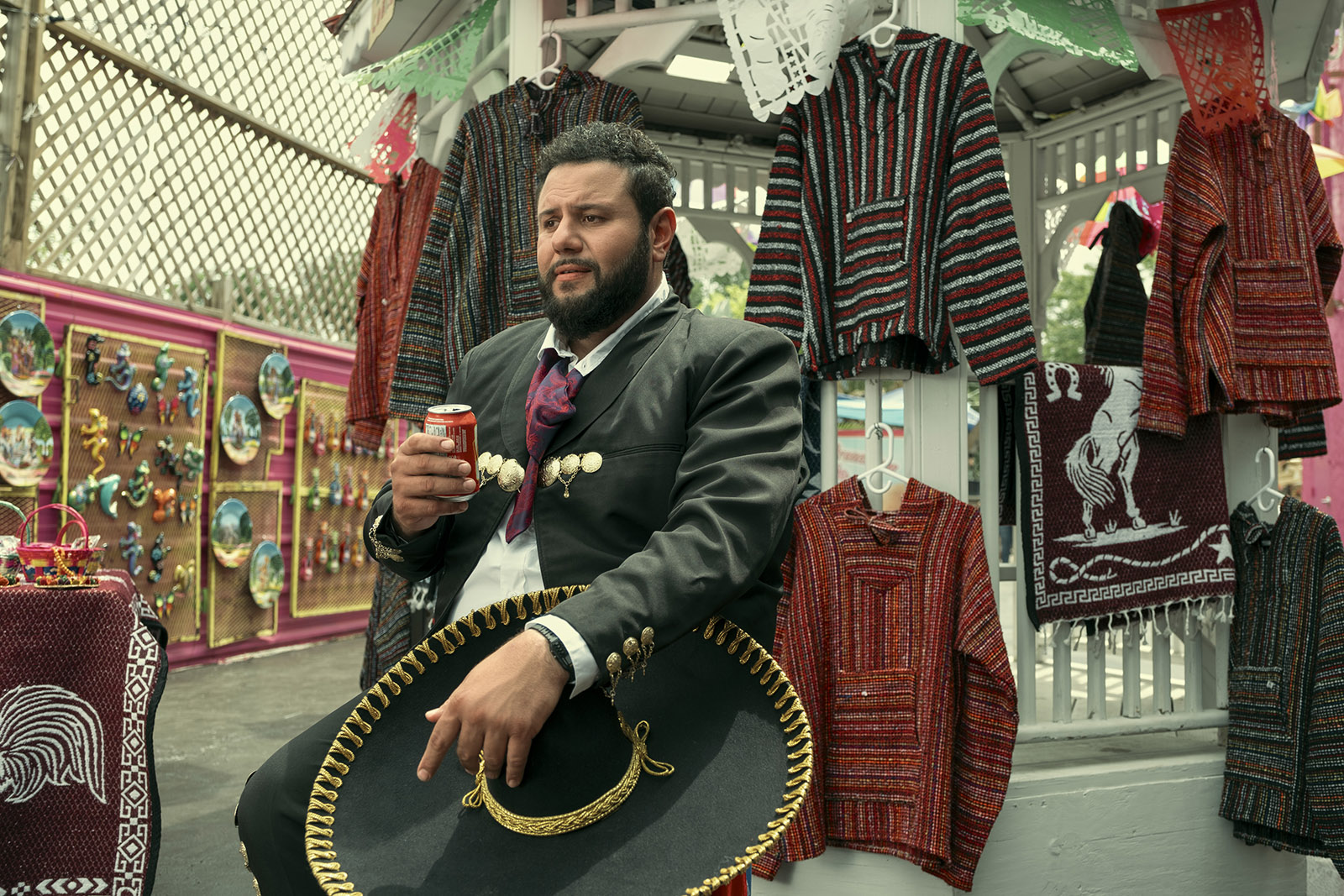 Still from the Netflix series Mo. Image shows Mo Amer's character dressed as a mariachi. 