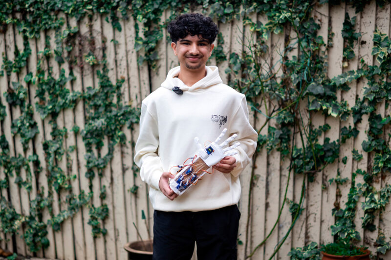 Suleymaan Khan with one of the robotic hands he has made