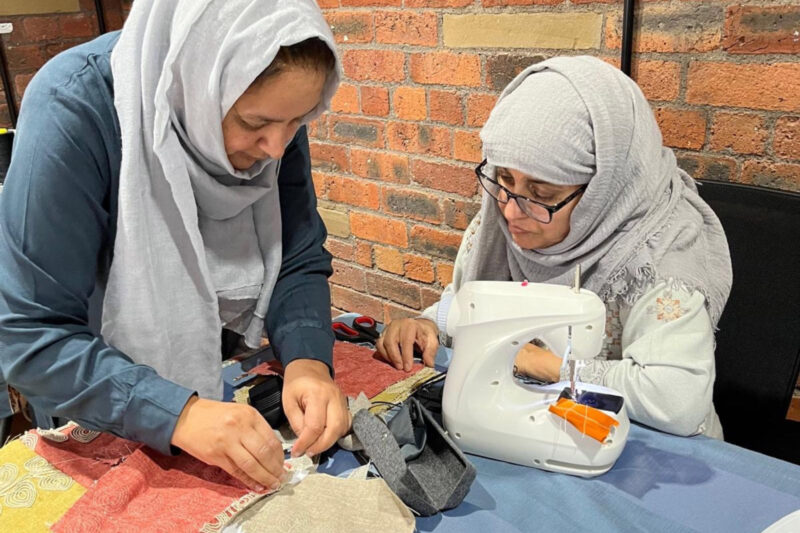 Participants at Sewcialise, the Yorkshire Women's Forum's weekly sewing and textile group at Manningham Mills, Bradford
