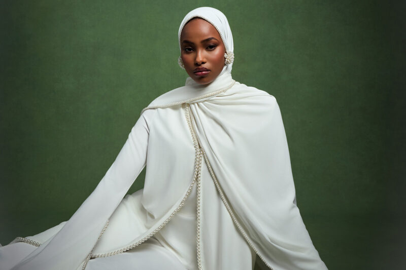 Photograph of a woman modelling a Kayesha abaya, by London-based fashion brand Khanum's