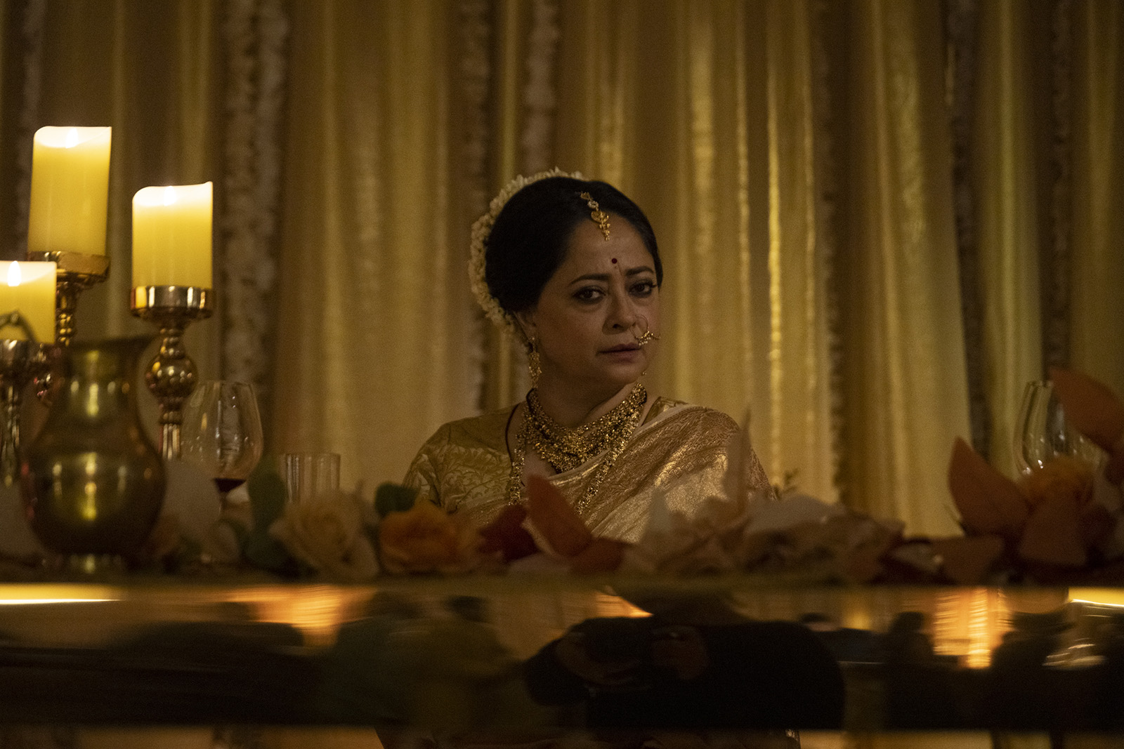 A still image from the film Hamlet, featuring actor Sheeba Chaddha in costumer as the titular character's mother, Gertrude