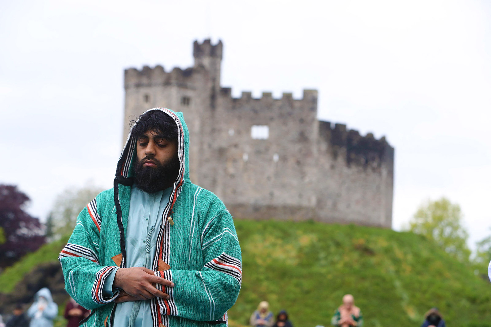 Muslims perform the Eid al-Fitr prayer outside Cardiff Castle in May 2021