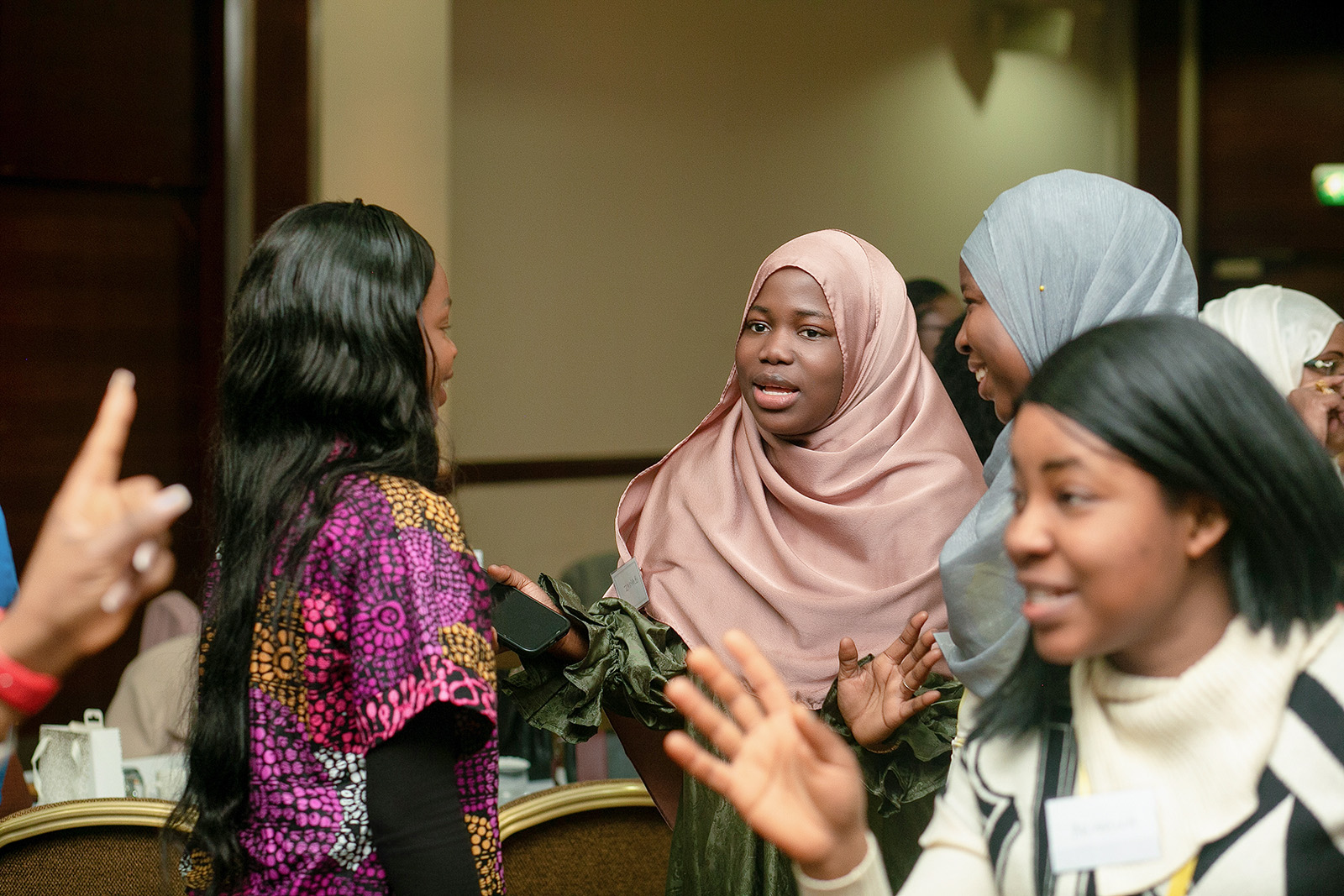 A photograph of guests at a 2025 BloomElle International Women's Day event