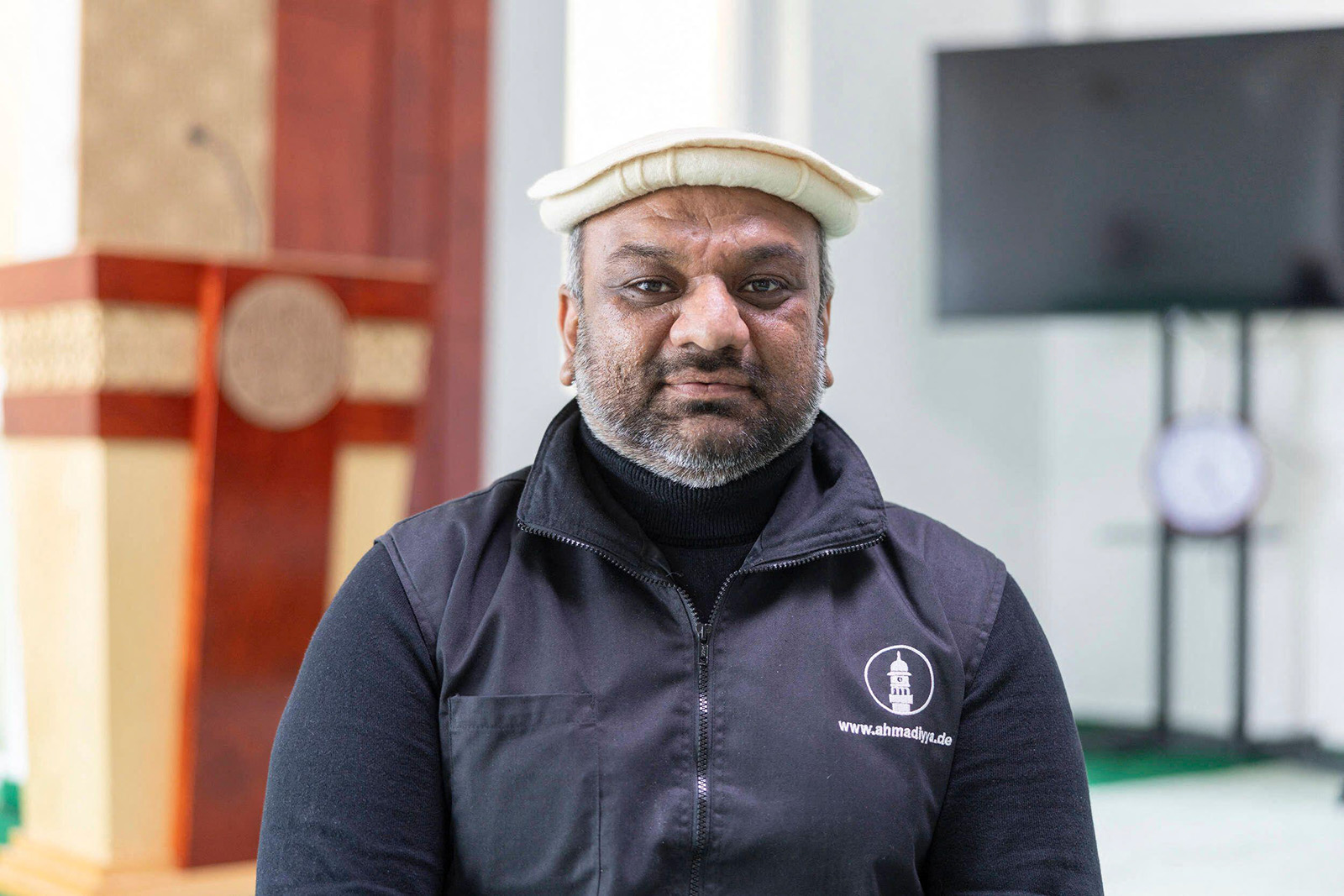 A portrait photograph of Suleman Malik, president of Erfurt's Ahmadiyya community