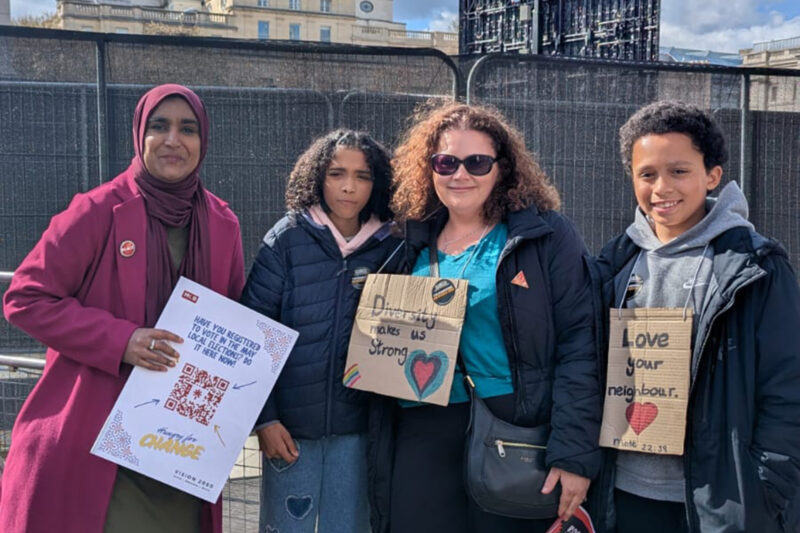 Lotifa Begum (left) with a Hungry For Change voter registration sign in London at the Together Alliance March Against the Far Right in March 30th 2026