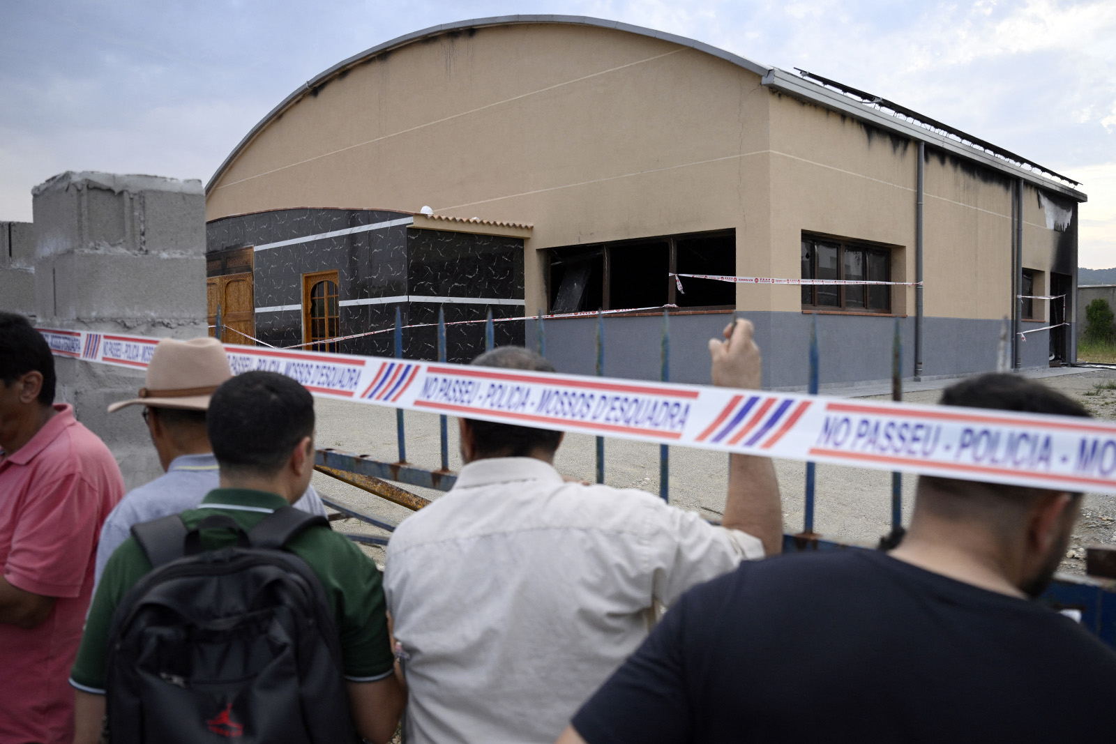 A photograph showing people gathering outside Piera's mosque after a demonstration to condemn the arson attack that damaged the building on 12 July, 2025.
