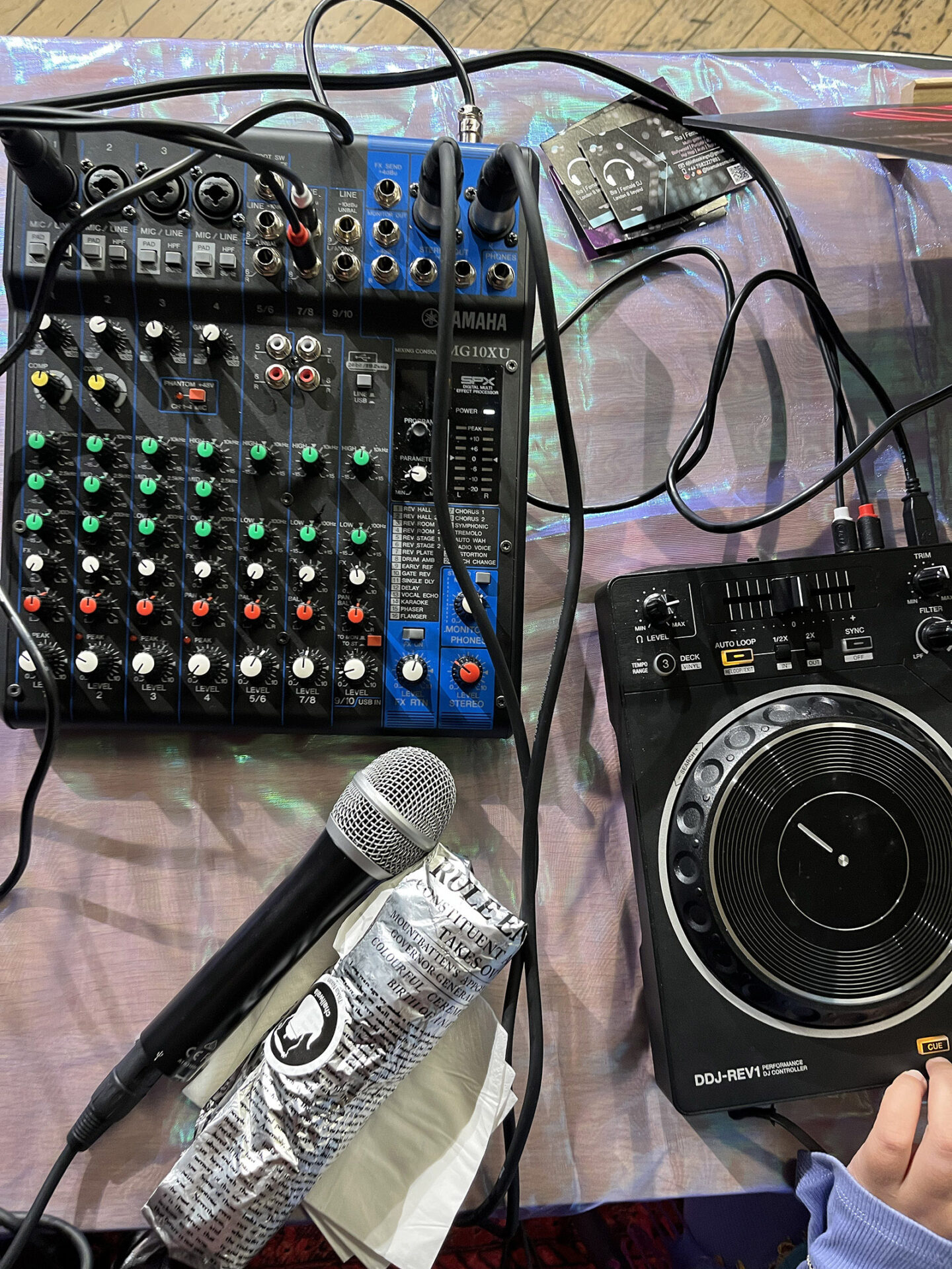 A photograph of the DJ set up for one of Bint Bash's parties, featuring a Yahama audio mixer, microphone and Pioneer DJ controller
