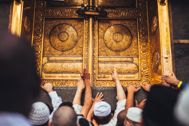 Pilgrims reach towards the Kaaba during Hajj in Mecca, Saudi Arabia.