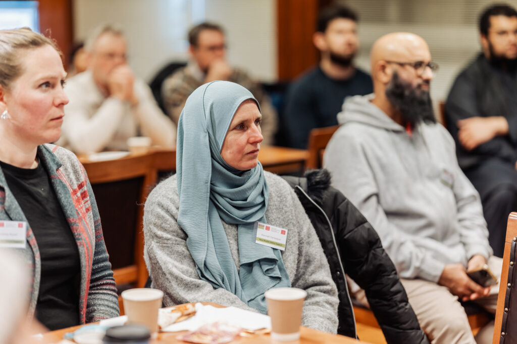 A photograph of Muslim converts at a research event hosted by the Convert Muslim Foundation and Cardiff University in London, 2025