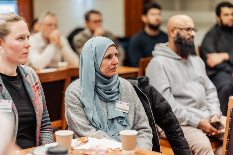 A photograph of Muslim converts at a research event hosted by the Convert Muslim Foundation and Cardiff University in London, 2025